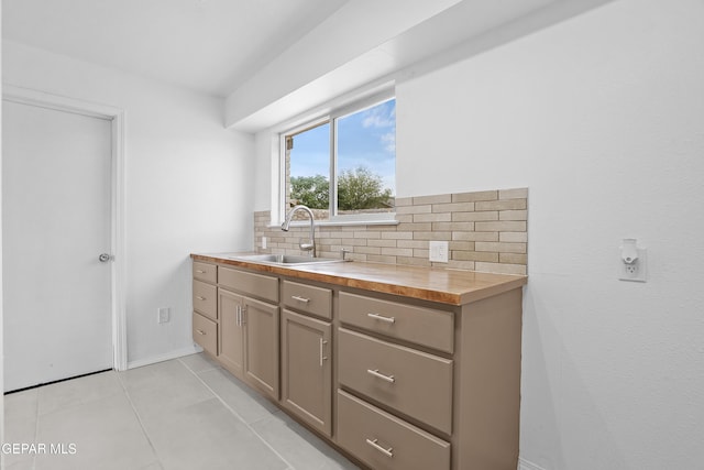 205 Caribe Cir, El Paso, TX 79927 - kitchen with butcher block counters, tasteful backsplash, and light tile patterned floors