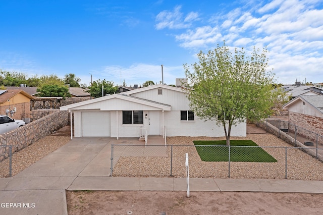 205 Caribe Cir, El Paso, TX 79927 - view of front of house featuring an attached garage, brick siding, and driveway