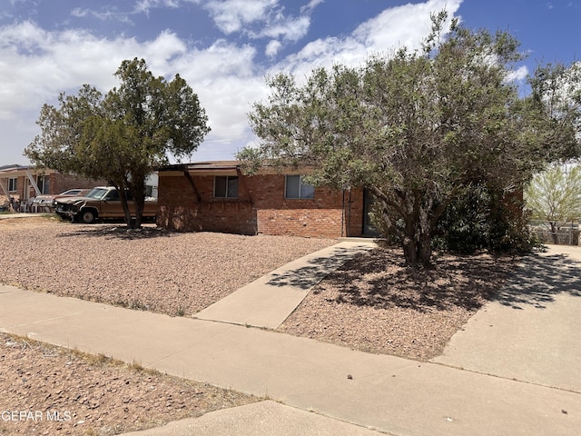 5013 Winthrop Dr, El Paso, TX 79924 - view of front of house with brick siding and concrete driveway