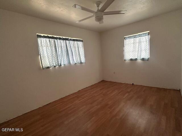 1137 Cimarron St, El Paso, TX 79915 - empty room featuring wood finished floors and ceiling fan
