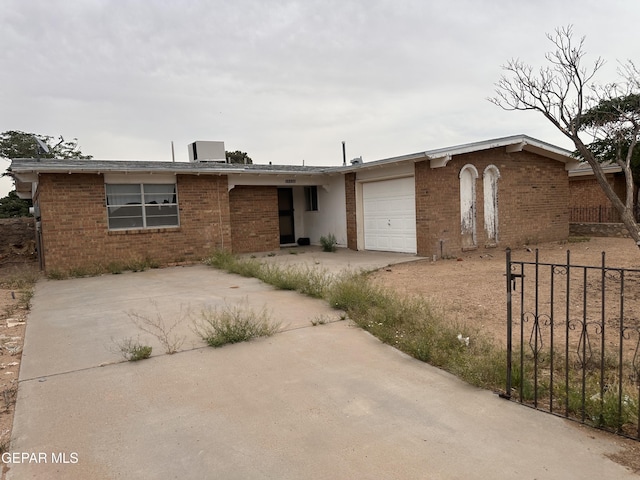 10436 Orpheus Dr, El Paso, TX 79924 - single story home featuring an attached garage, brick siding, and concrete driveway