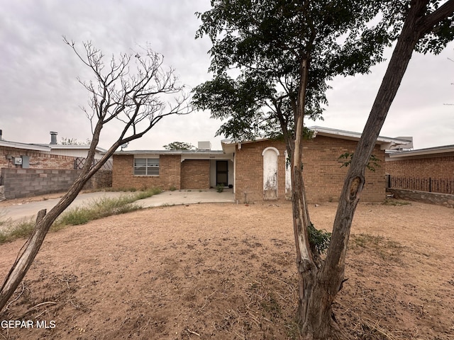 10436 Orpheus Dr, El Paso, TX 79924 - rear view of property with a patio area and brick siding