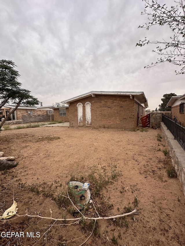 10436 Orpheus Dr, El Paso, TX 79924 - view of side of home with brick siding