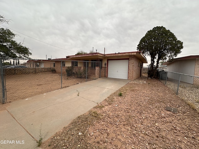 10416 Triumph Dr, El Paso, TX 79924 - ranch-style home featuring an attached garage, concrete driveway, and brick siding