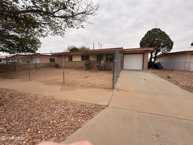 10416 Triumph Dr, El Paso, TX 79924 - ranch-style house with driveway, a garage, and brick siding