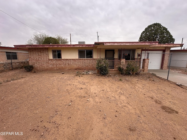 10416 Triumph Dr, El Paso, TX 79924 - single story home with a garage, driveway, brick siding, and covered porch