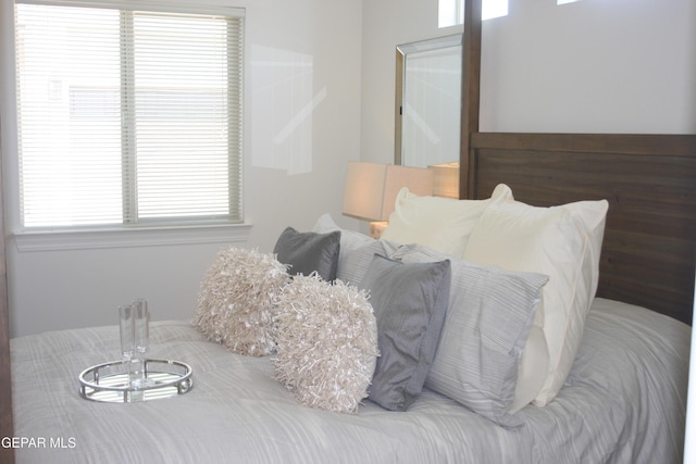 1374 Gusart Ave, El Paso, TX 79928 - bedroom featuring multiple windows