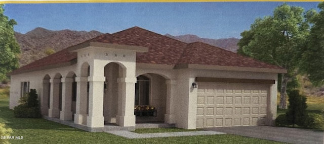 1374 Gusart Ave, El Paso, TX 79928 - mediterranean / spanish house with an attached garage, driveway, a mountain view, and stucco siding