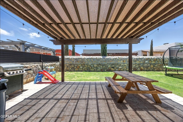 14516 Jesus Almeida, El Paso, TX 79938 - wooden deck with a trampoline, a fenced backyard, a patio, and outdoor dining space