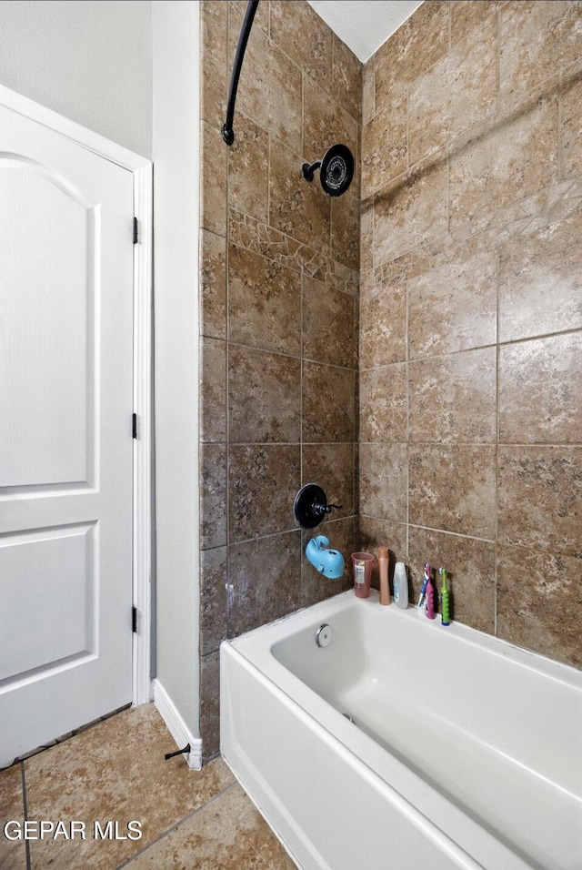 14516 Jesus Almeida, El Paso, TX 79938 - bathroom featuring shower / tub combination and baseboards
