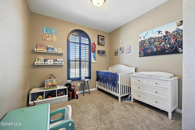 14516 Jesus Almeida, El Paso, TX 79938 - carpeted bedroom with a crib and baseboards