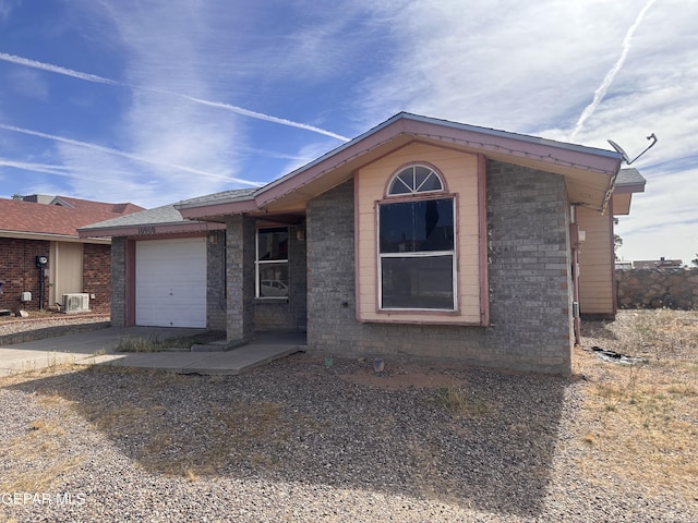 10900 Joe Dimaggio Cir, El Paso, TX 79934 - view of front facade featuring a garage, concrete driveway, and brick siding