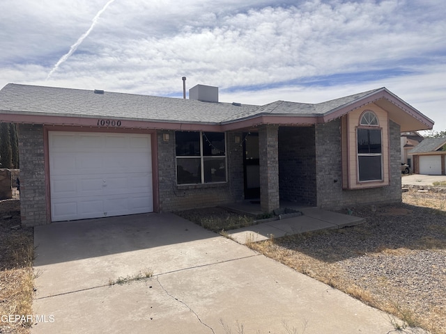 10900 Joe Dimaggio Cir, El Paso, TX 79934 - single story home featuring concrete driveway, an attached garage, and brick siding