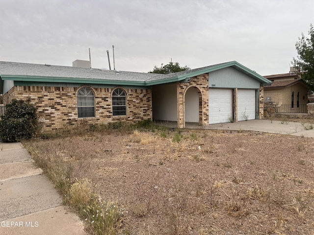 10428 Cronus Dr, El Paso, TX 79924 - single story home featuring a garage, brick siding, and driveway