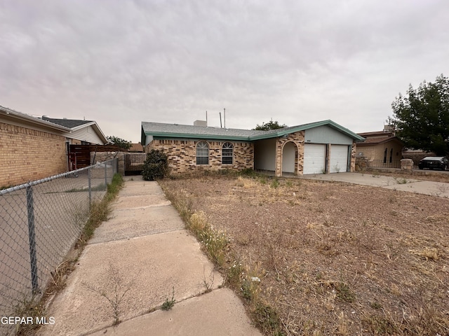 10428 Cronus Dr, El Paso, TX 79924 - view of front of house featuring an attached garage, concrete driveway, and brick siding