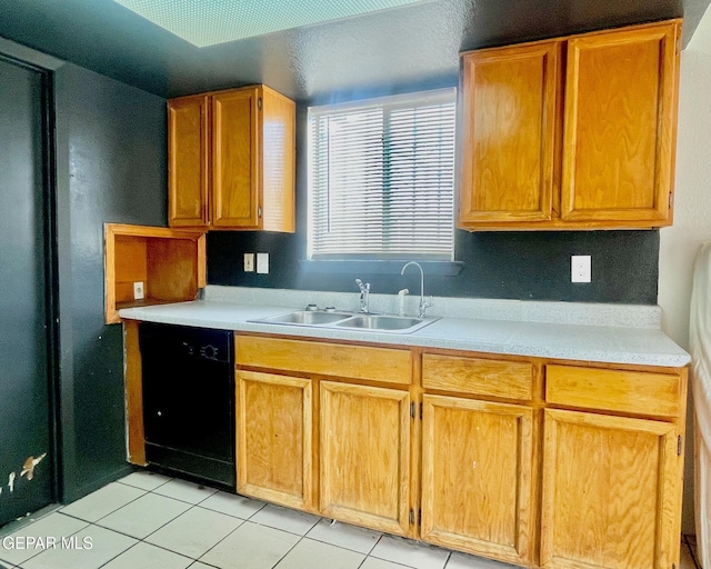 1611 James Chisum Dr, El Paso, TX 79936 - kitchen featuring black dishwasher, light tile patterned flooring, and light countertops