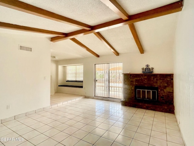 1611 James Chisum Dr, El Paso, TX 79936 - unfurnished living room with a fireplace, a textured ceiling, and light tile patterned floors