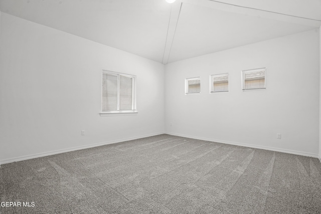 2301 Tony Harper St, El Paso, TX 79938 - carpeted empty room featuring lofted ceiling and baseboards