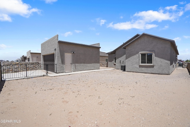 2301 Tony Harper St, El Paso, TX 79938 - rear view of property featuring stucco siding