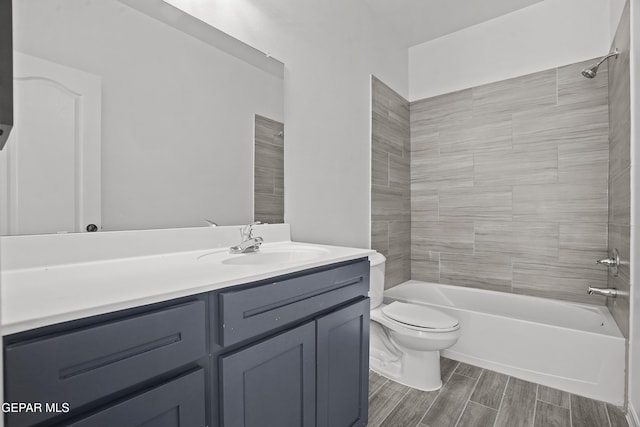 2301 Tony Harper St, El Paso, TX 79938 - full bath featuring vanity, tub / shower combination, and wood finished floors