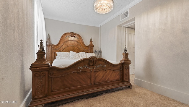 2123 Magoffin Ave, El Paso, TX 79901 - carpeted bedroom with a chandelier, a textured wall, ornamental molding, and a textured ceiling