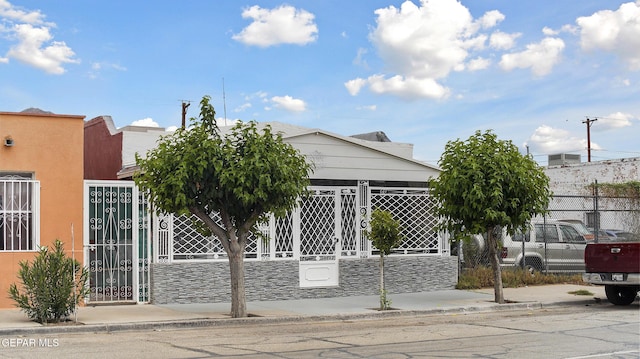 2123 Magoffin Ave, El Paso, TX 79901 - view of front of property with a gate and stone siding