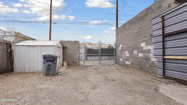 2123 Magoffin Ave, El Paso, TX 79901 - view of patio with a gate and a storage unit