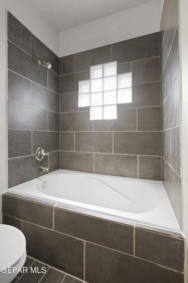 14325 Toby Davis Dr, Horizon City, TX 79928 - bathroom with toilet and tiled shower / bath