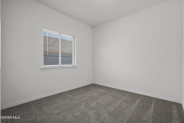 14325 Toby Davis Dr, Horizon City, TX 79928 - empty room with dark colored carpet and baseboards