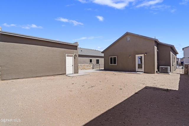 14325 Toby Davis Dr, Horizon City, TX 79928 - back of house with stucco siding, a patio, and a gate