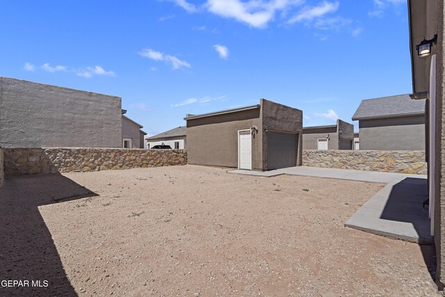 14325 Toby Davis Dr, Horizon City, TX 79928 - view of yard with an outbuilding and a garage