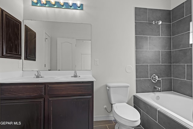 14325 Toby Davis Dr, Horizon City, TX 79928 - full bath with double vanity, tiled shower / bath combo, and tile patterned flooring
