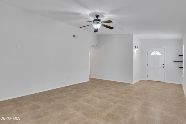 14304 Woods Point Ave, El Paso, TX 79938 - unfurnished living room featuring ceiling fan and arched walkways