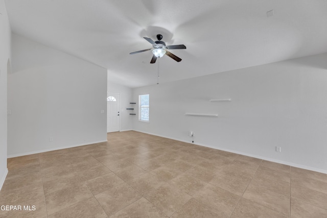 14304 Woods Point Ave, El Paso, TX 79938 - spare room featuring a ceiling fan, lofted ceiling, and light tile patterned floors