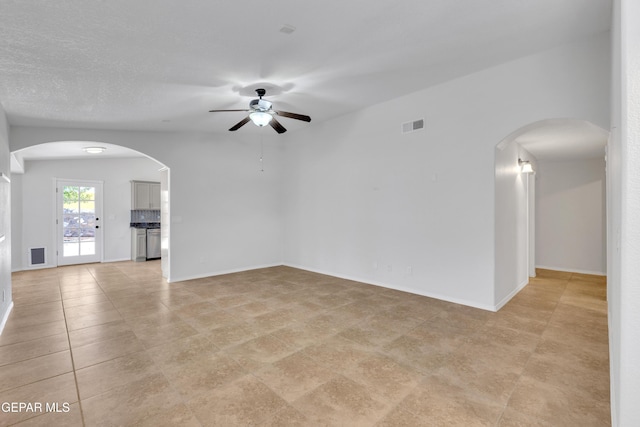 14304 Woods Point Ave, El Paso, TX 79938 - empty room featuring a ceiling fan and arched walkways
