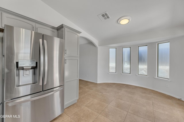 14304 Woods Point Ave, El Paso, TX 79938 - kitchen with stainless steel fridge with ice dispenser, light tile patterned flooring, and gray cabinetry