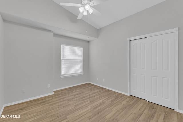 14304 Woods Point Ave, El Paso, TX 79938 - unfurnished bedroom featuring vaulted ceiling, light wood-style flooring, a closet, and a ceiling fan