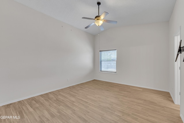 14304 Woods Point Ave, El Paso, TX 79938 - unfurnished room featuring lofted ceiling, light wood-style floors, and ceiling fan