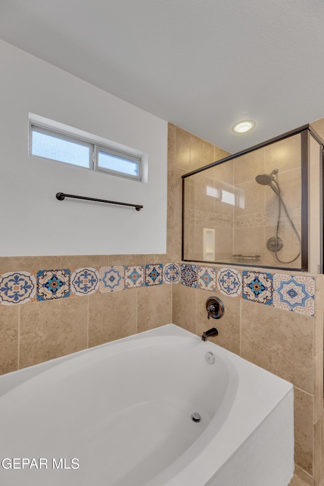 14304 Woods Point Ave, El Paso, TX 79938 - bathroom with a bath and a tile shower