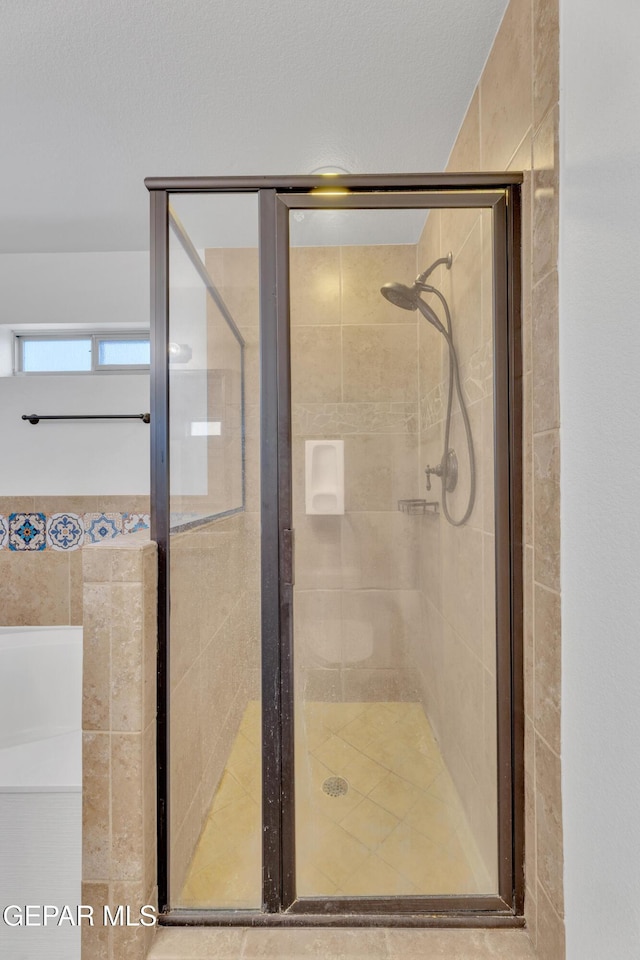 14304 Woods Point Ave, El Paso, TX 79938 - full bathroom featuring a stall shower and a garden tub
