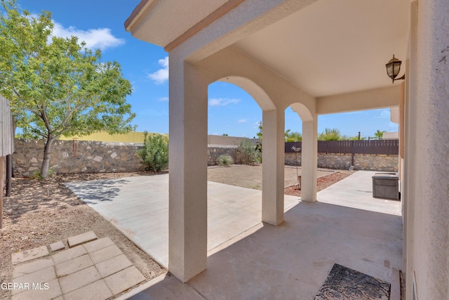 14304 Woods Point Ave, El Paso, TX 79938 - fenced backyard with a patio
