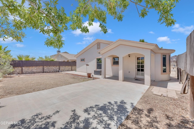 14304 Woods Point Ave, El Paso, TX 79938 - rear view of house with stucco siding, a patio area, and a fenced backyard