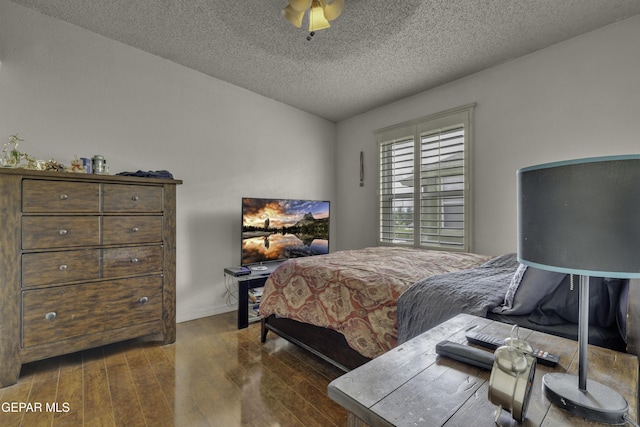 12372 Robert Dahl Dr, El Paso, TX 79938 - bedroom with wood finished floors and a textured ceiling