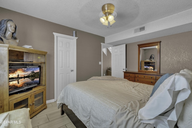 12372 Robert Dahl Dr, El Paso, TX 79938 - bedroom featuring a textured ceiling and a ceiling fan