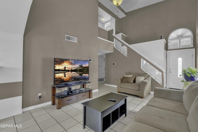 12372 Robert Dahl Dr, El Paso, TX 79938 - living room featuring a high ceiling, stairs, and light tile patterned floors