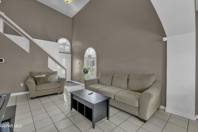 12372 Robert Dahl Dr, El Paso, TX 79938 - living room with a high ceiling, stairs, light tile patterned flooring, and a ceiling fan
