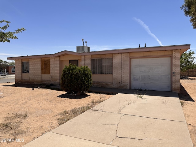 10452 Omega Cir, El Paso, TX 79924 - view of front of property featuring brick siding, driveway, and a garage