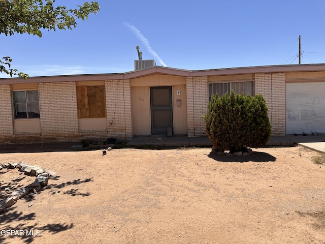 10452 Omega Cir, El Paso, TX 79924 - view of front of property featuring brick siding and an attached garage