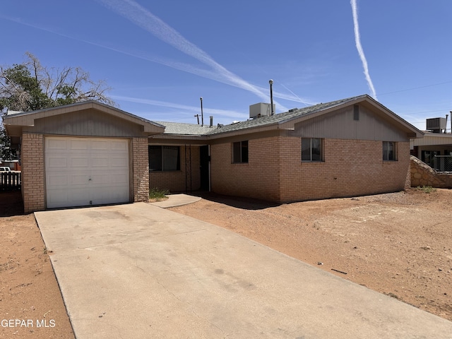 5513 Fairbanks Dr, El Paso, TX 79924 - ranch-style house with brick siding, an attached garage, and concrete driveway