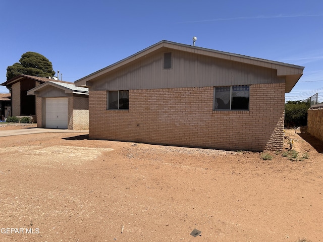 5513 Fairbanks Dr, El Paso, TX 79924 - view of side of home with brick siding and driveway